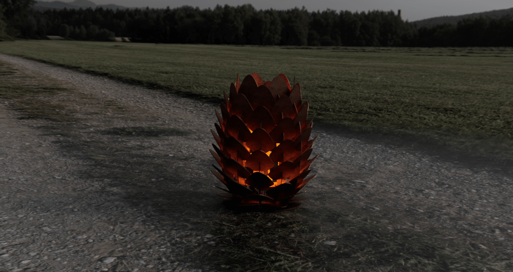 Kotte Fire Pit med glödande eld mellan de överlappande cortenplåtarna.